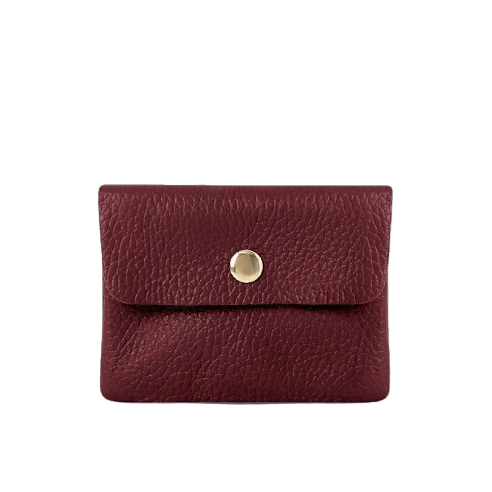 Red leather wallet with a gold button on a white background