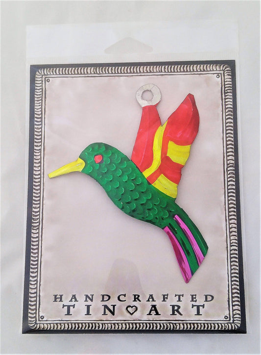 Handmade in Mexico, metal hummingbird milagros with vibrant colours in packaging