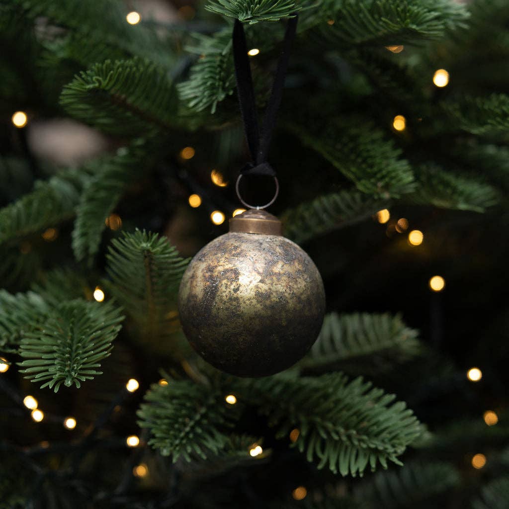Detail of matt green patina on a mouth-blown glass bauble
