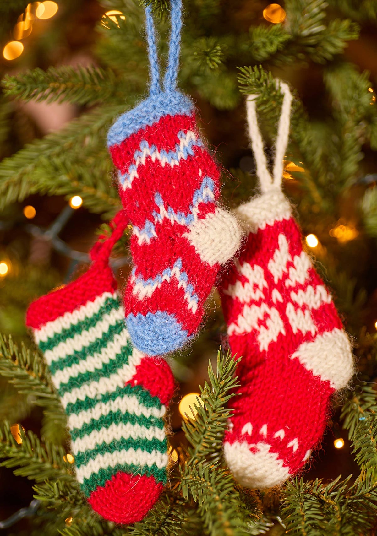 Knitted wool stocking Christmas tree decoration with snowflake and zig-zag pattern