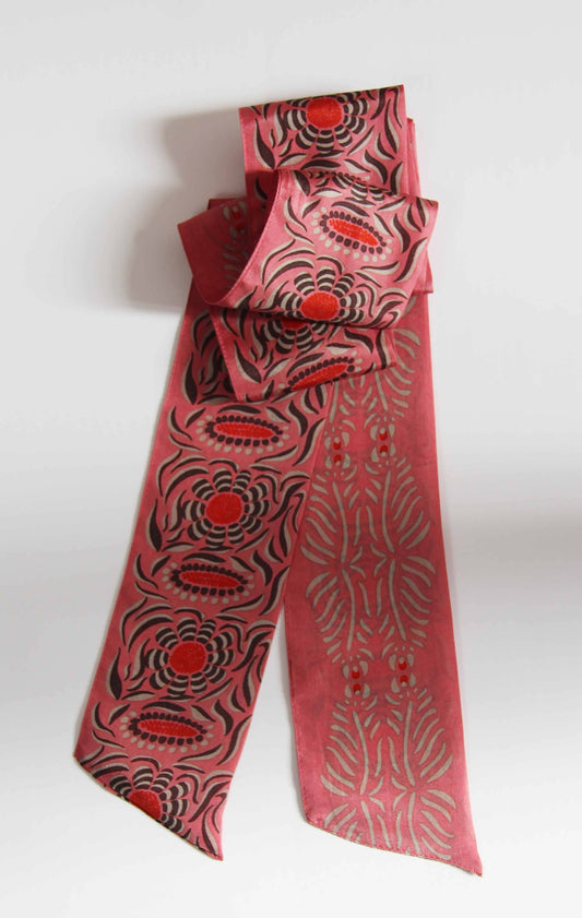 Red and black patterned fabric skinnyh scarf