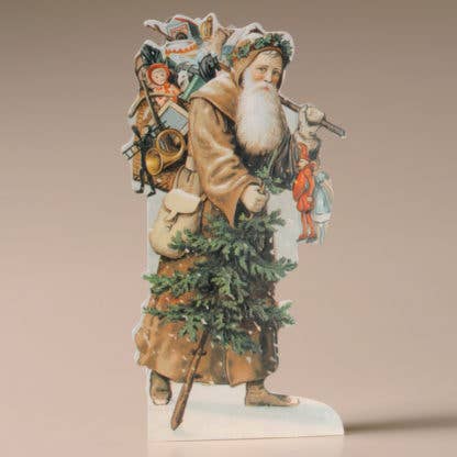 Decorative paper cutout card of a traditional Santa Claus holding a tree