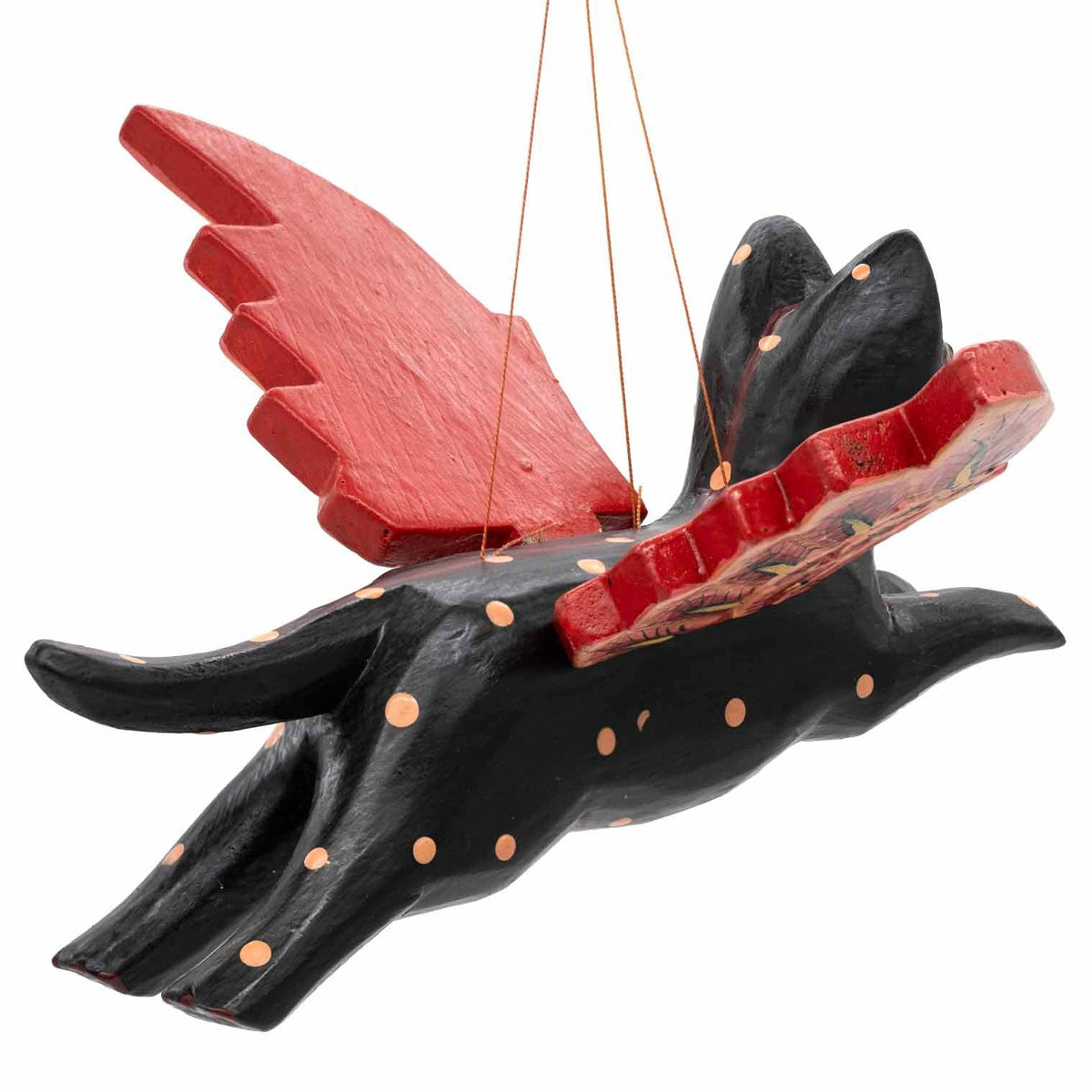 Feathered red-tipped wings on a carved flying cat
