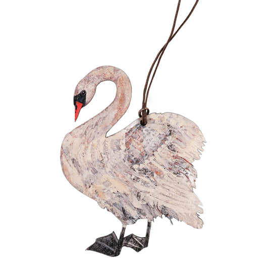 A wooden decoration in the shape of a swan with a grey and white pattern, with a brown waxed cotton thread attached for hanging.