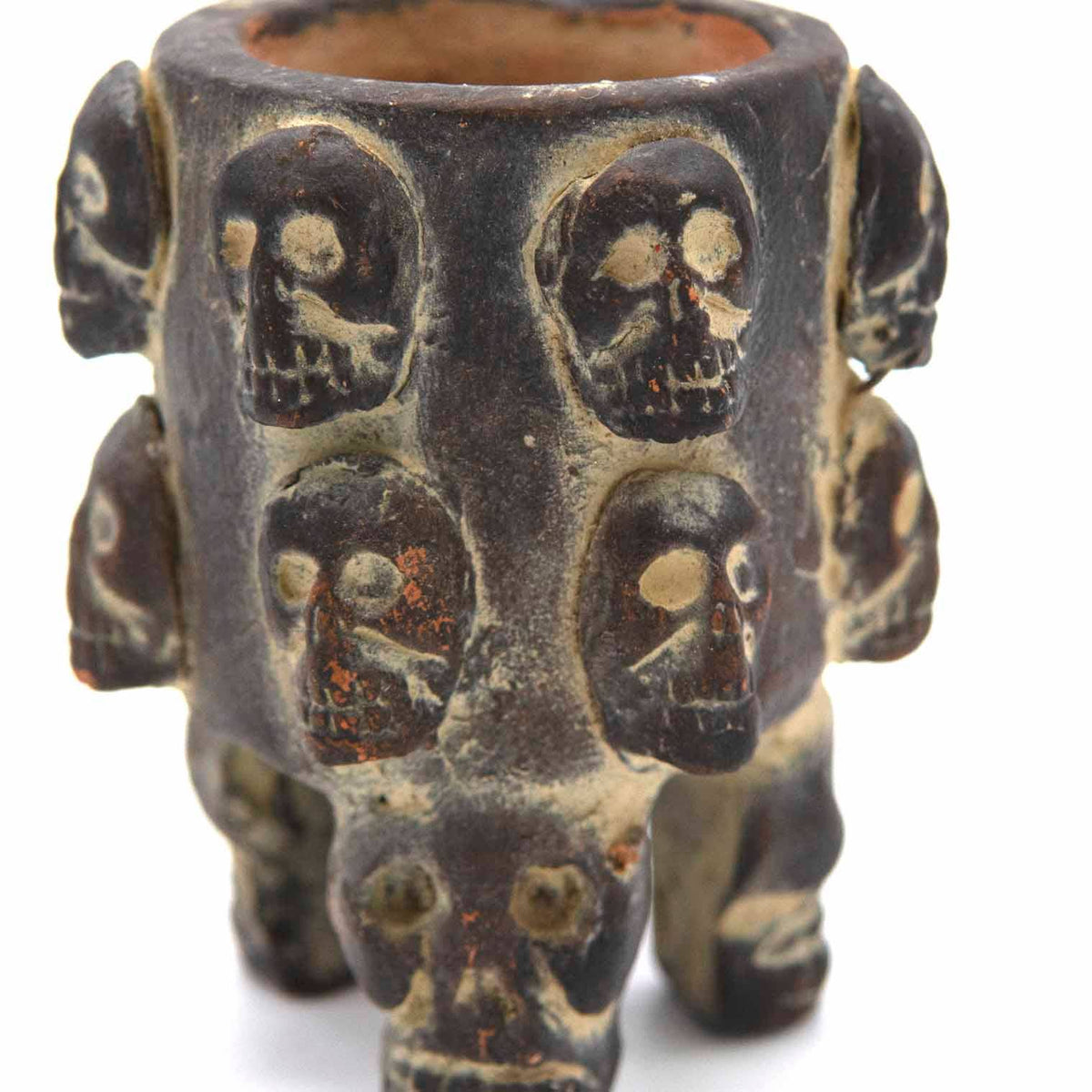 Handmade ceramic skull pot inspired by the Mesoamerican tzompantli