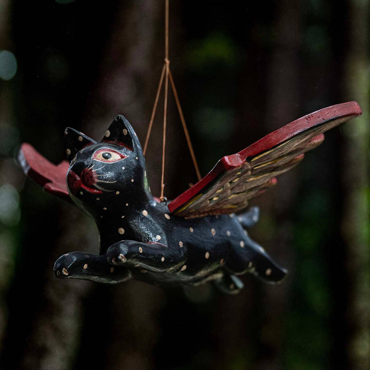 Flying cat hanging decoration painted black and red