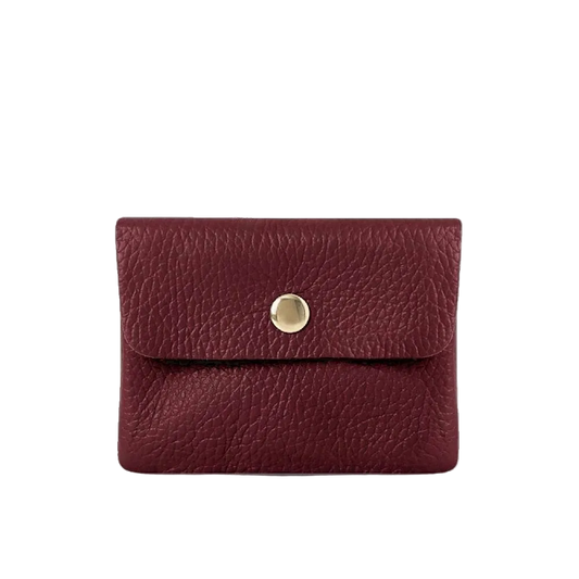 Red leather wallet with a gold button on a white background