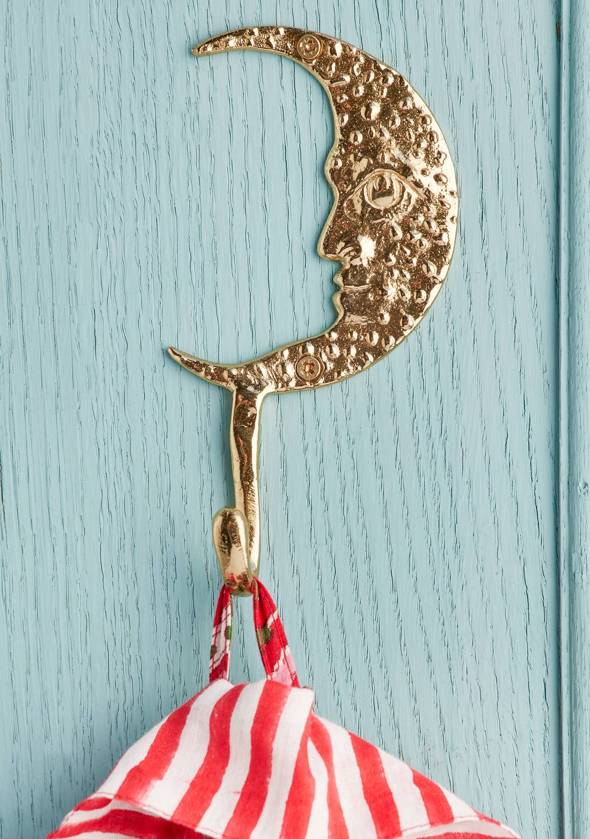 Crescent moon wall hook showing two screw holes
