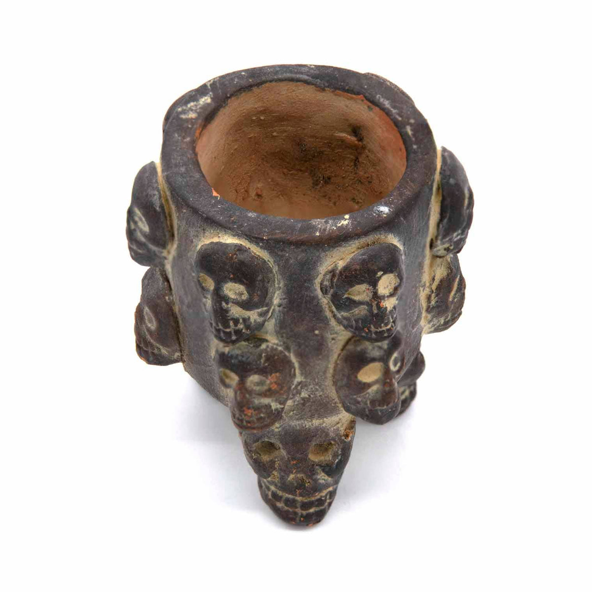 Side view of a handmade ceramic skull pot