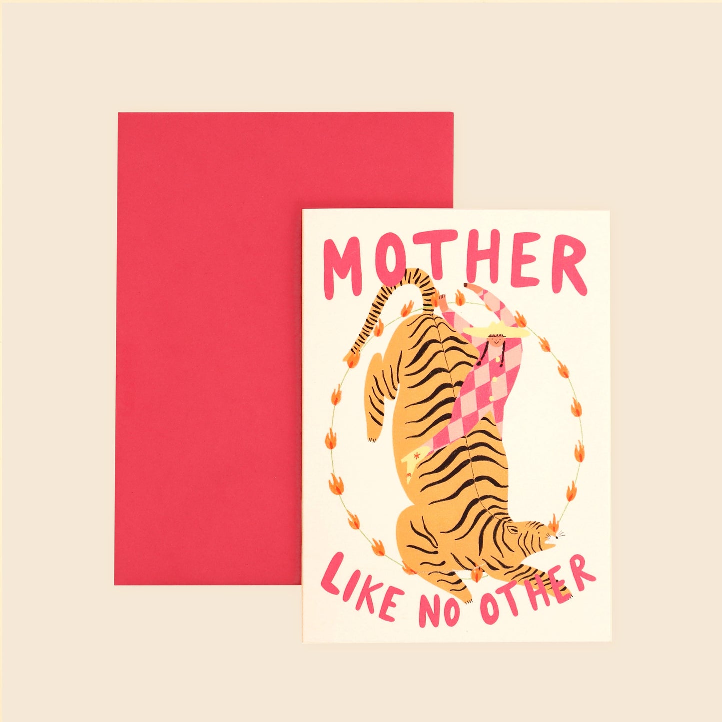A greeting card with an illustration of a mother figure riding a tiger, with the text 'MOTHER LIKE NO OTHER' on it, accompanied by a pink envelope.