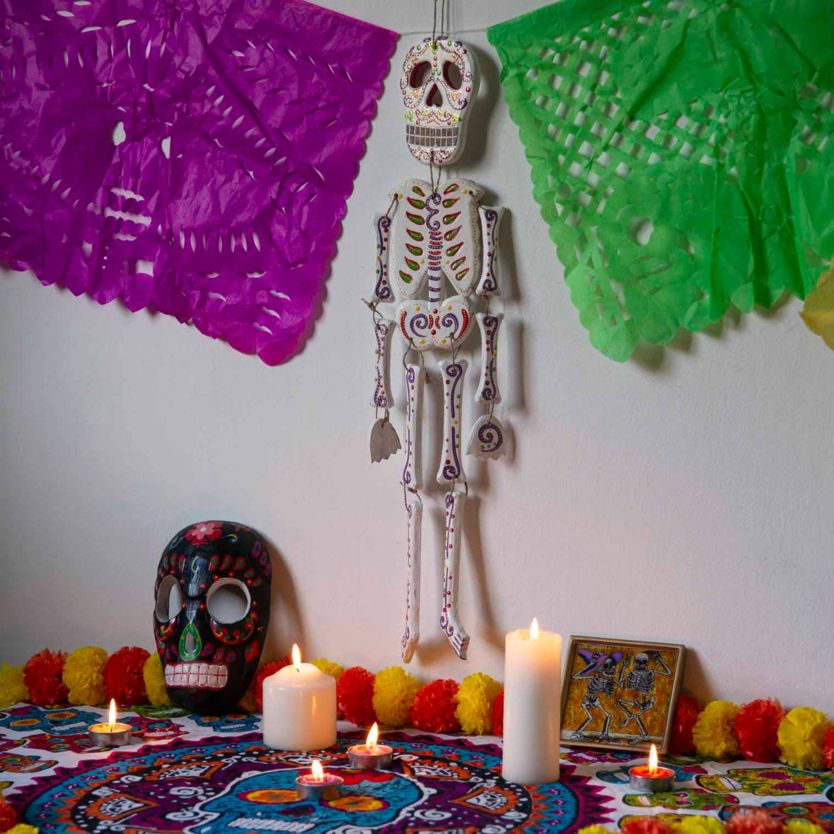 Detail of the painted skull on a wooden candy skeleton