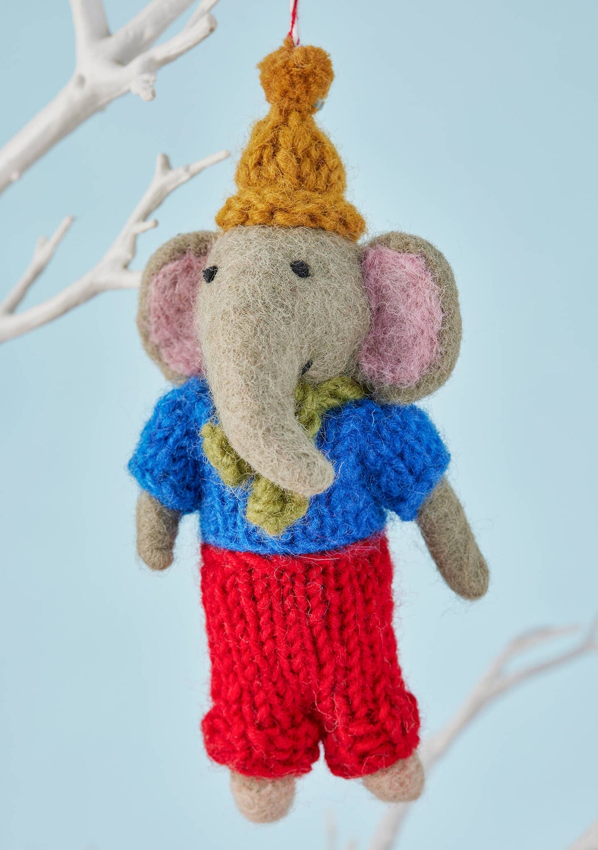 Needle-felted grey wool elephant Christmas decoration in winter clothes