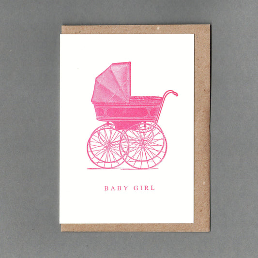 Letterpress greeting card with a pink baby pram and 'BABY GIRL' caption