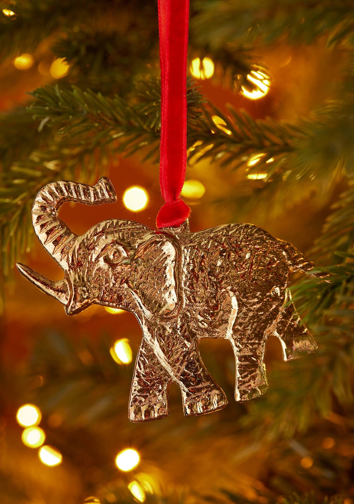 Gold recycled aluminium elephant decoration with raised trunk and red velvet loop