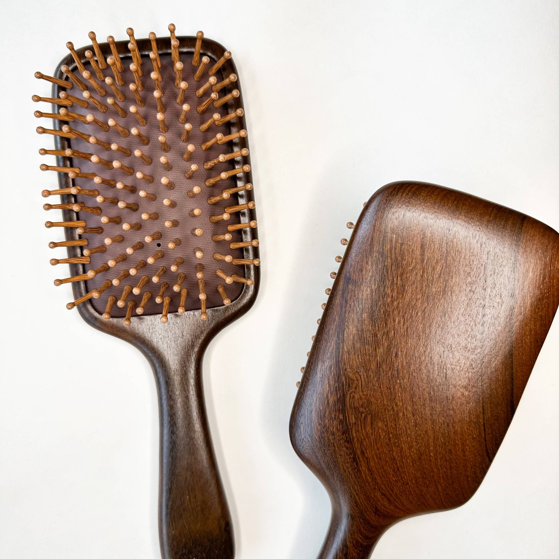 dark, natural wood hairbrush with eco bamboo bristles