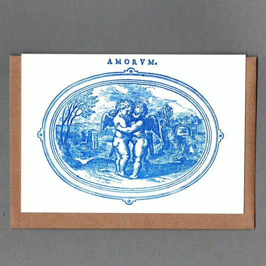 Greeting card with blue illustration and 'AMORVM' text on a gray background