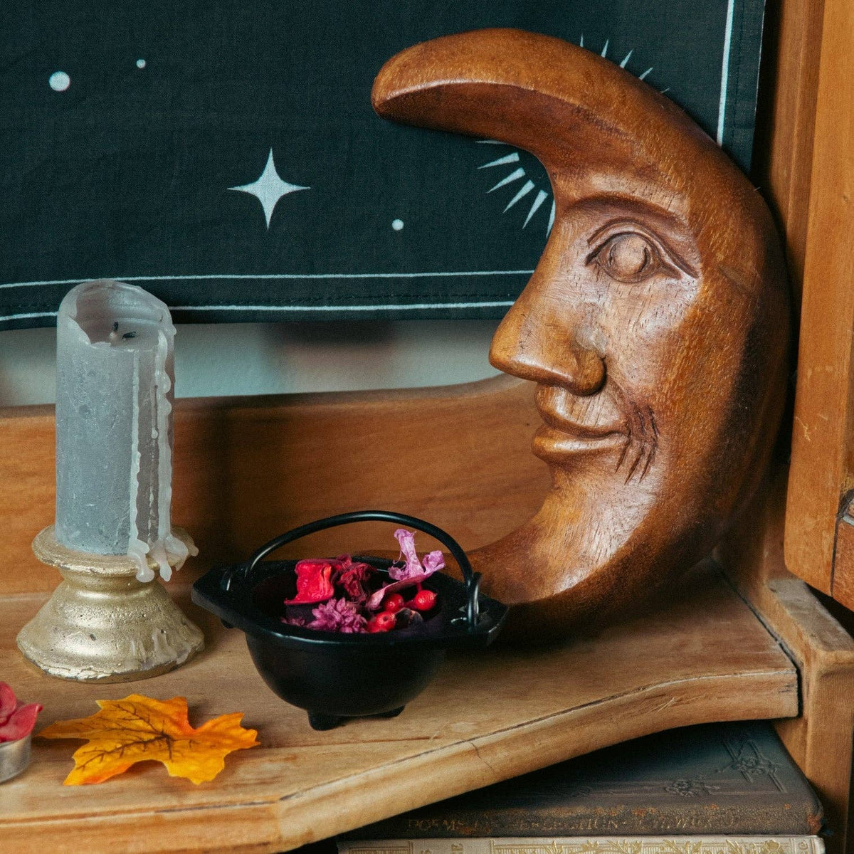 Hand-carved acacia wood crescent moon with a smiling face