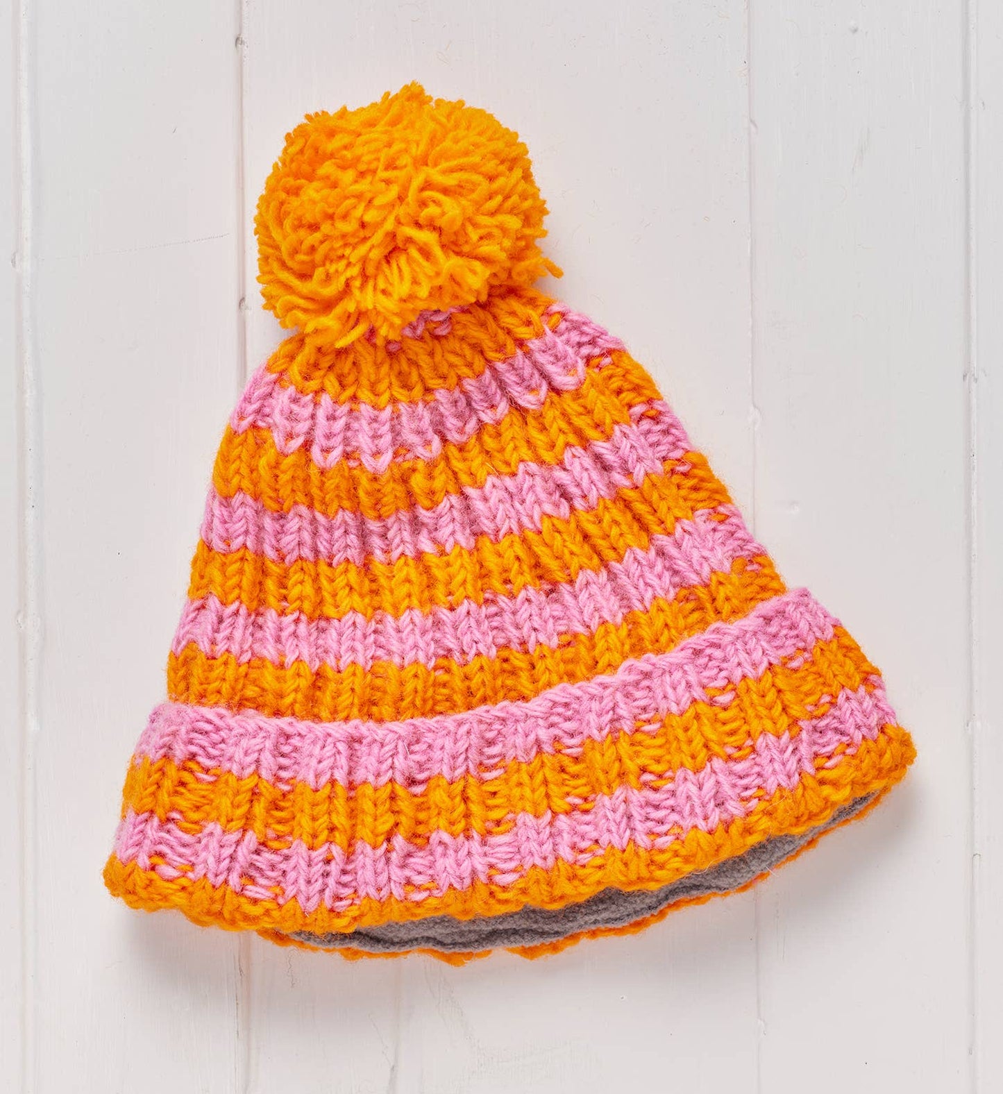 Knitted hat with orange and pink stripes 