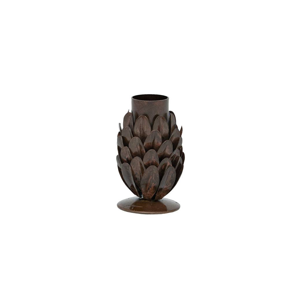 Artisan metal candlestick with natural rustic finish