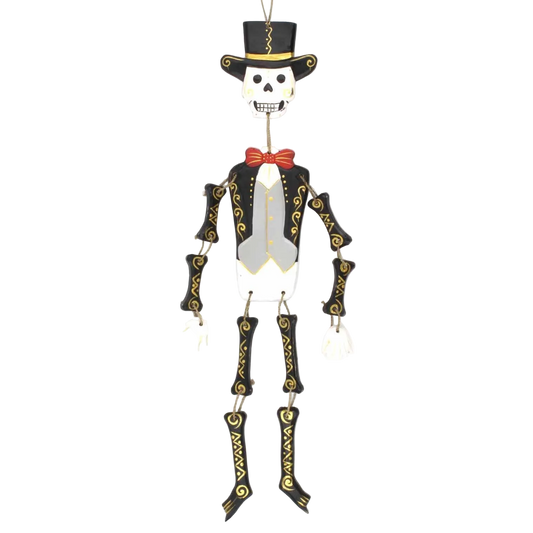 Hand-painted wooden Day of the Dead skeleton figure with dangling legs, carved in Bali