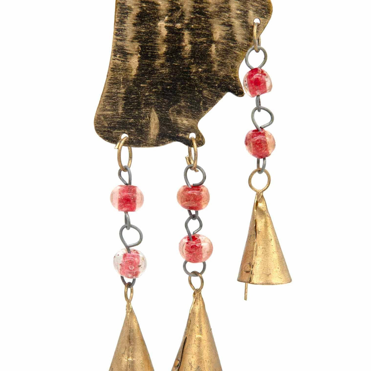 Small bells and beads beneath an iron angel hanging