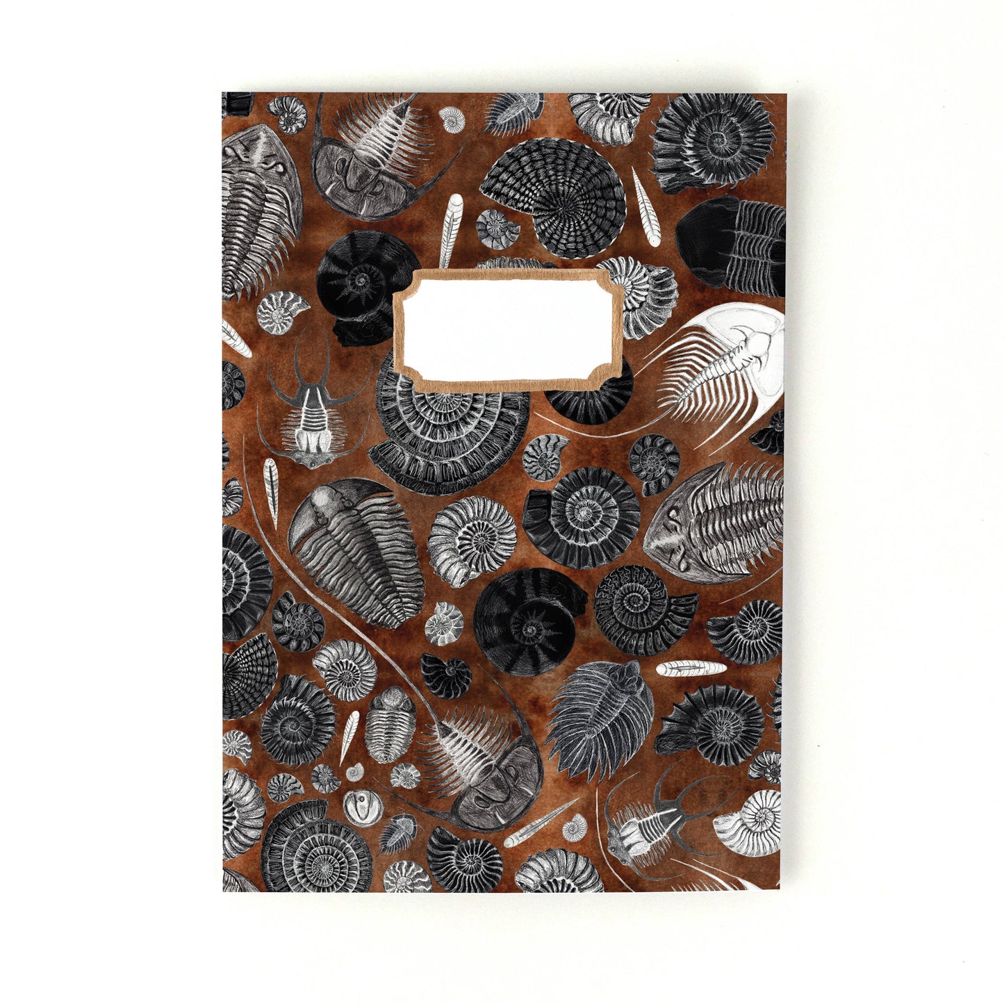 Hand-painted notebook with fossil design on a white background