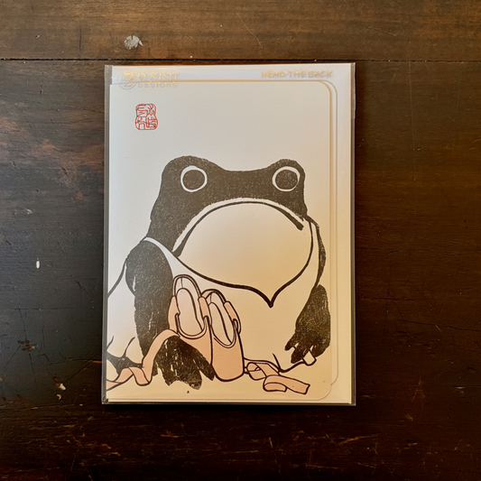 greeting card with a frog illustration with ballet shoes