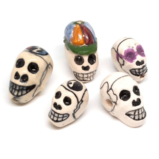 Assorted painted skull beads, each one different