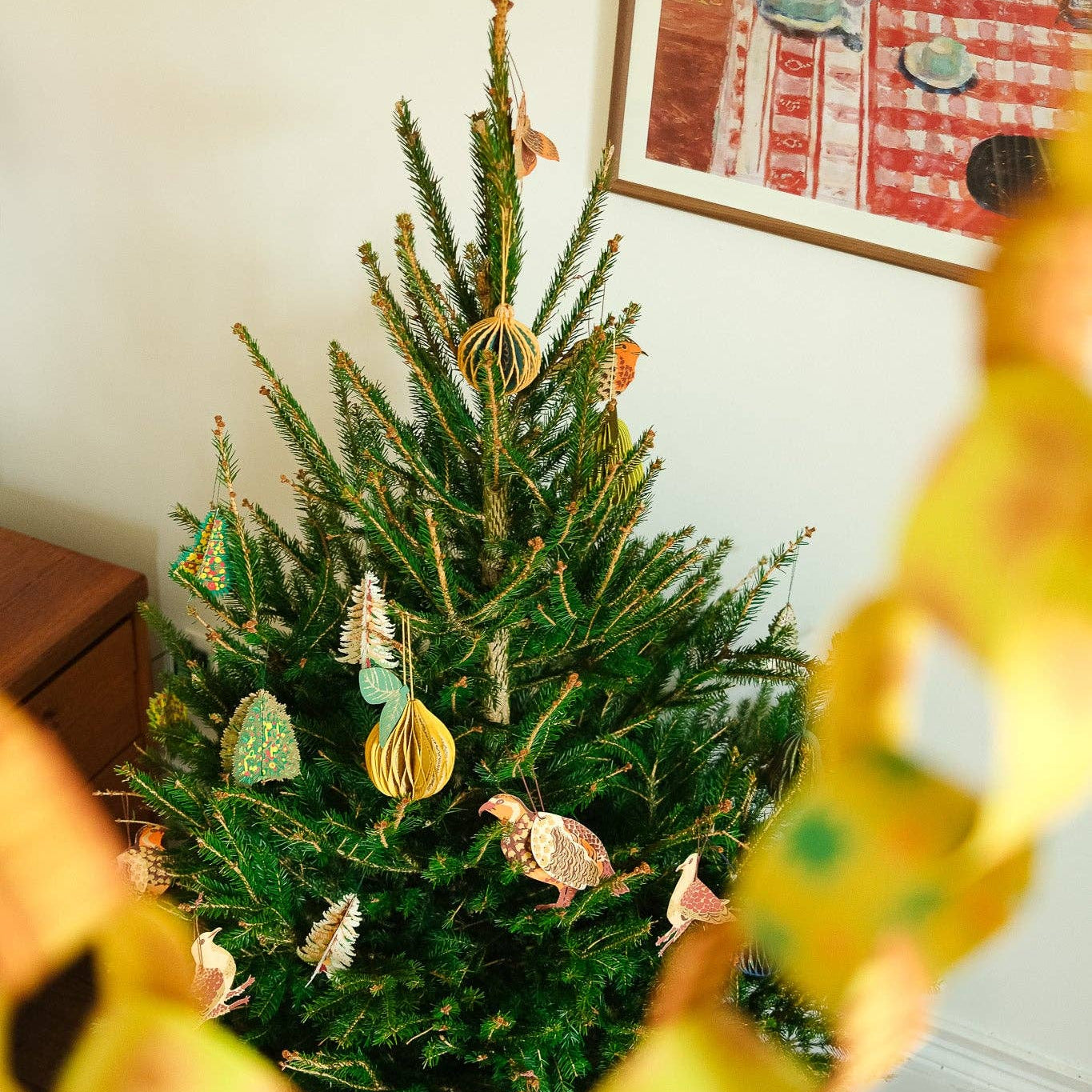 Decorated Christmas tree with East End Press paper ornaments