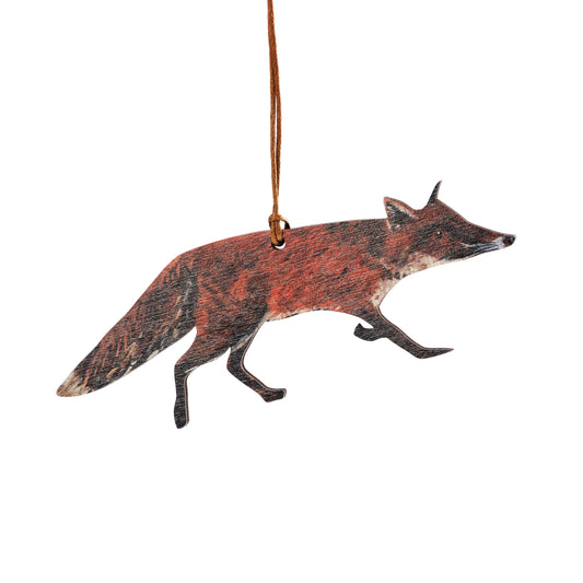 A wooden eco decoration in the shape of a fox, with a brown waxed cotton thread attached for hanging