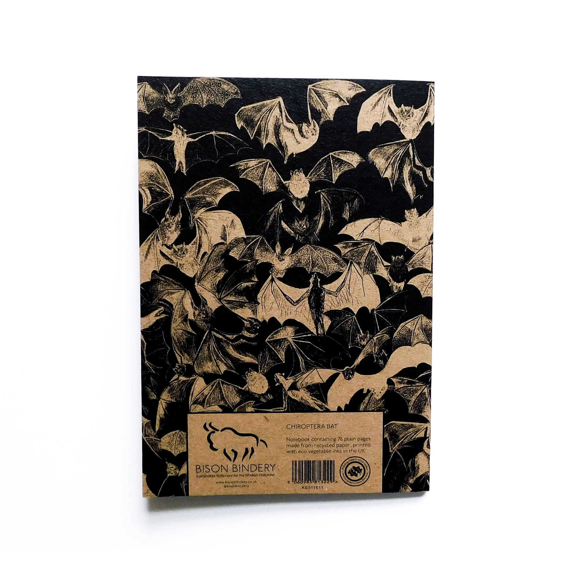 Notebook with bat pattern on black cover, Bison Bindery branding visible