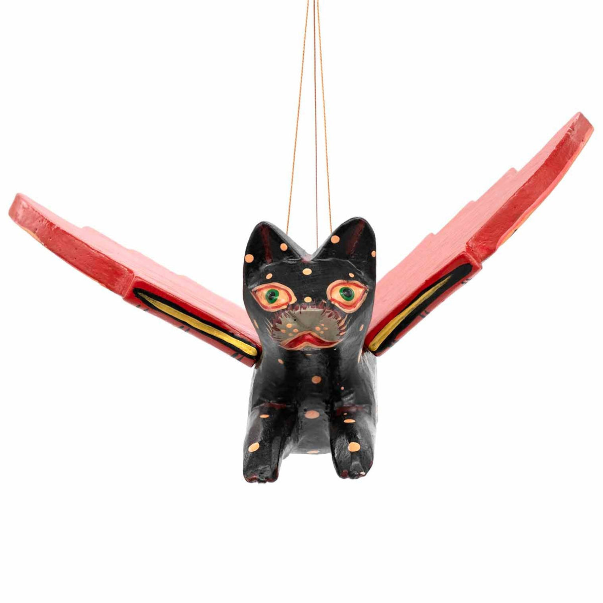 Painted face of a carved wooden flying cat
