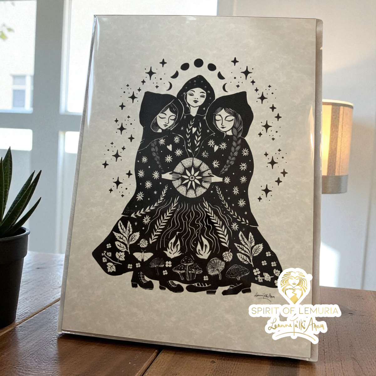 Sisters A4 folk art print, three women around an autumn fire beneath the moon phases, by Leanne Ta'Iki Anawa