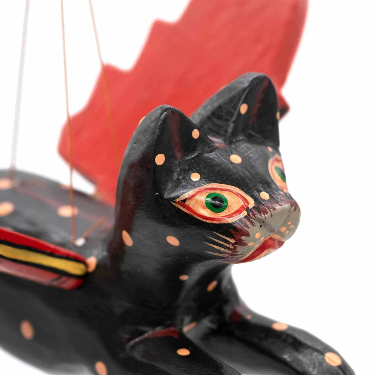Flying cat Halloween mobile hanging from a ceiling