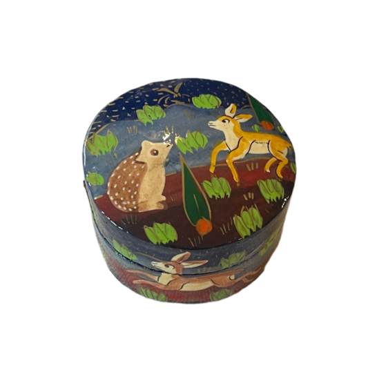 Round decorative box with animal illustrations on a white background