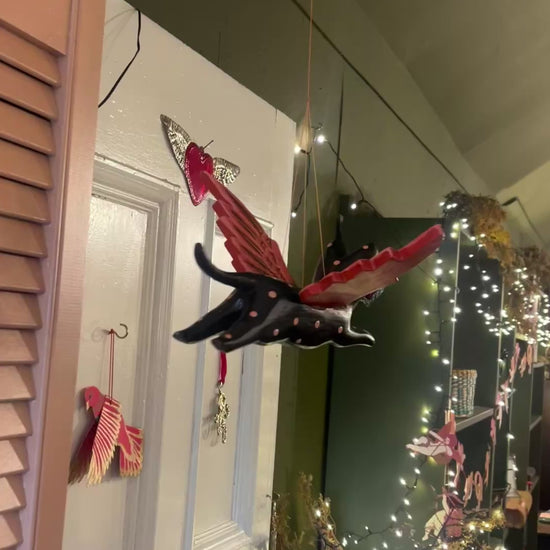 Flying cat Halloween mobile turning as it hangs