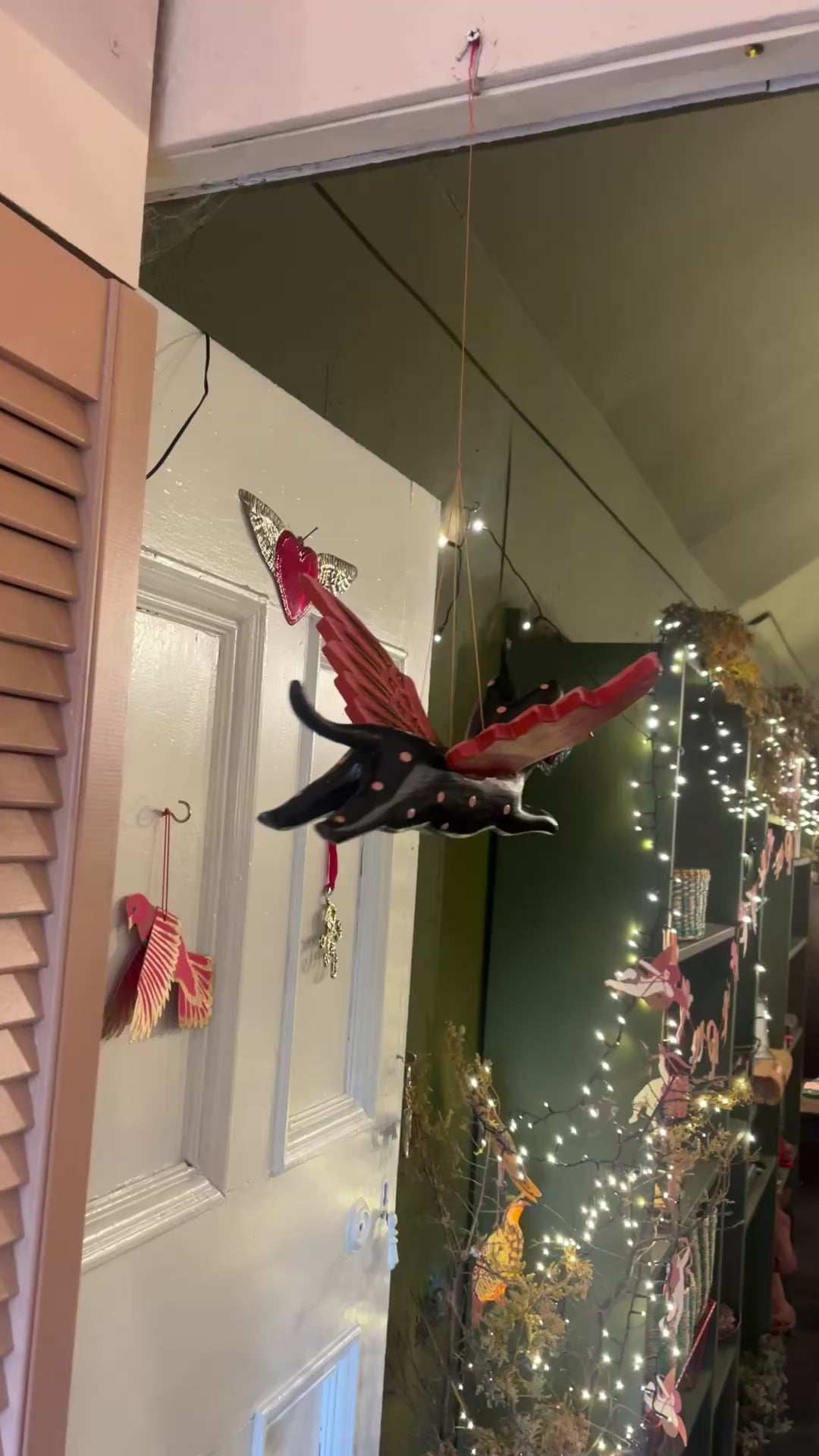 Flying cat Halloween mobile turning as it hangs